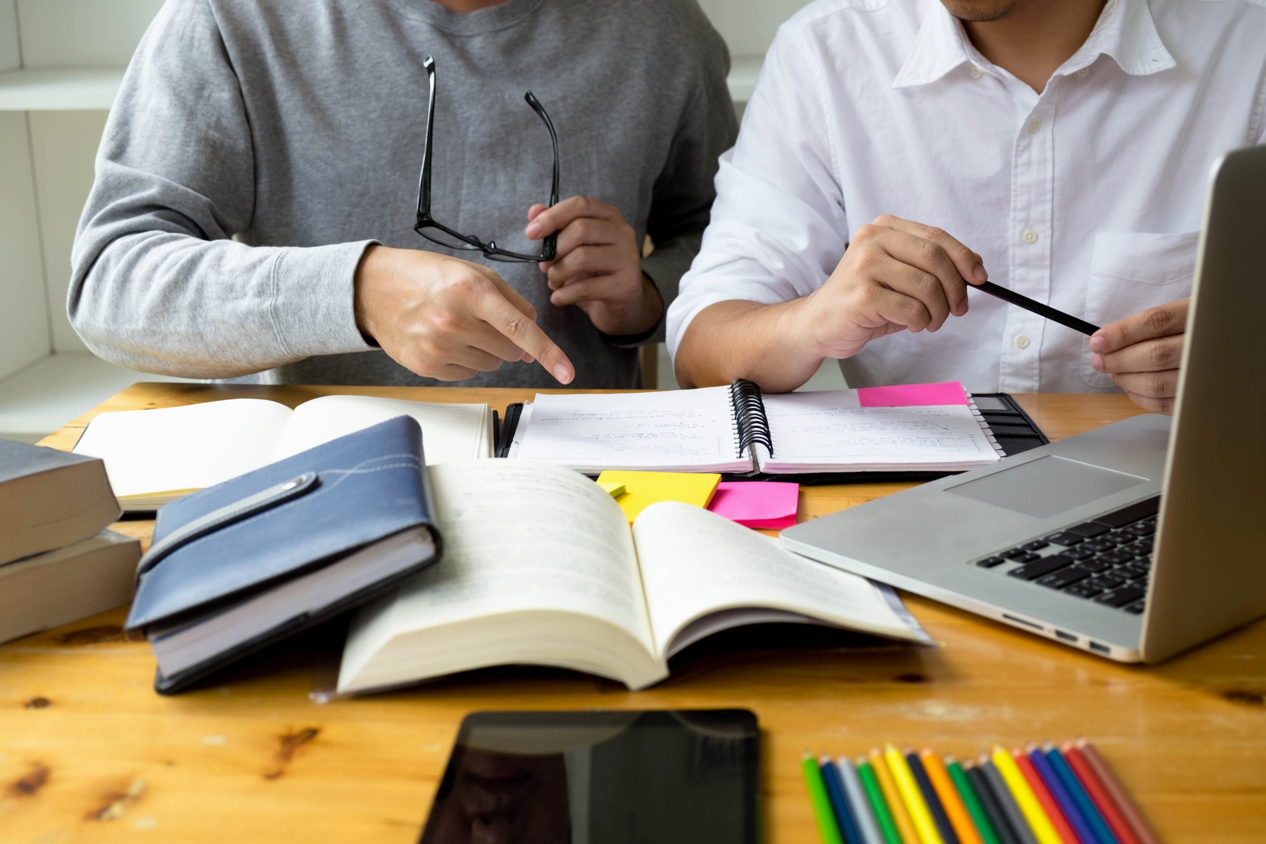 Students helps friend teaching and learning subject additional in library. using laptop to the education . education concept.